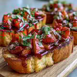 Fresh strawberry bruschetta with balsamic and mint on toasted baguette slices, perfect for summer gatherings and light appetizers.  