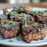 Juicy lamb rib chops served with a bright mint gremolata, perfect for a Mediterranean-inspired Easter dinner.
