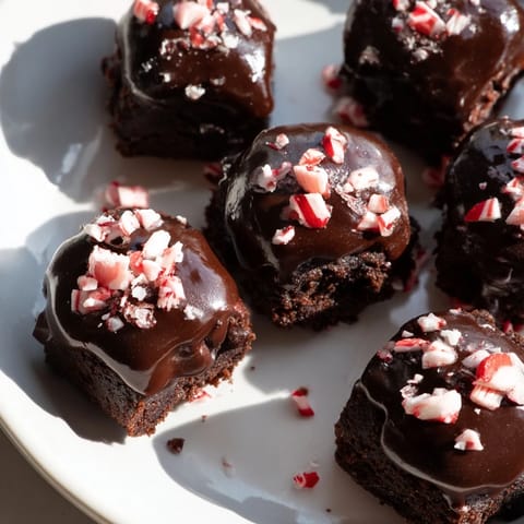 Freshly baked Peppermint Mocha Brownie Bites exude espresso aroma and a delightful minty coolness.