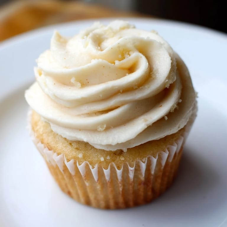 Vanilla cupcakes with creamy frosting, a perfect dessert, imagine the soft, sweet texture and flavor.
