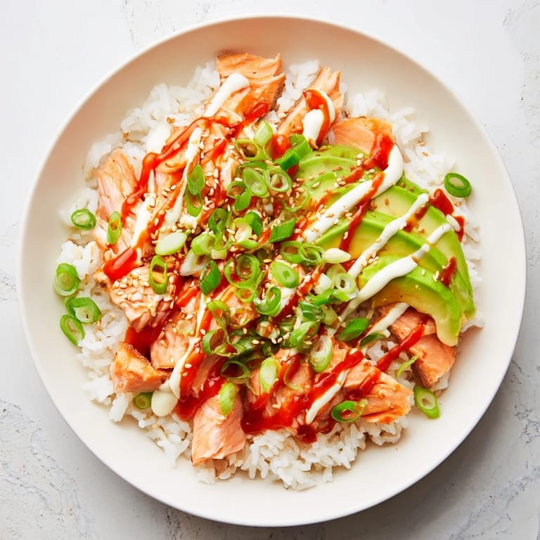 Enjoy the savory Classic Salmon Rice, with sesame seeds and seaweed; perfect for a quick dinner.