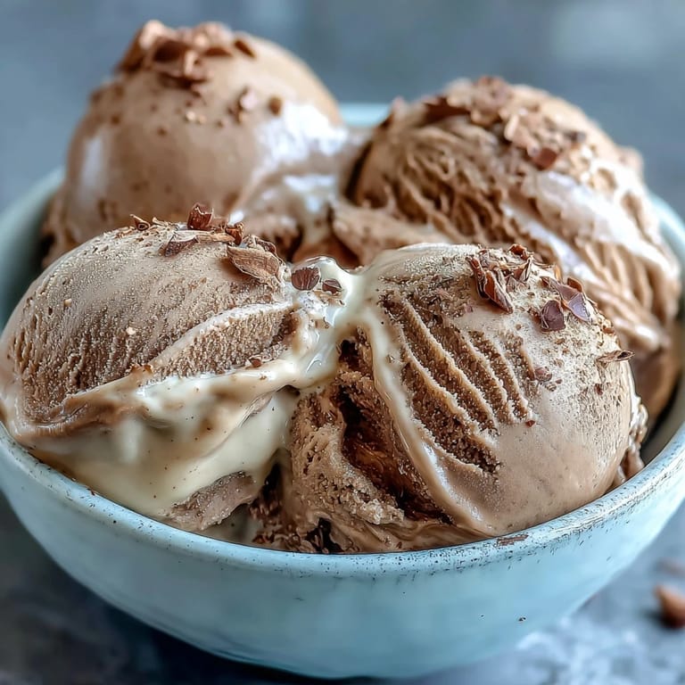 Warm Hojicha Ice Cream melts slightly over a mochi dessert platter with fresh berries.